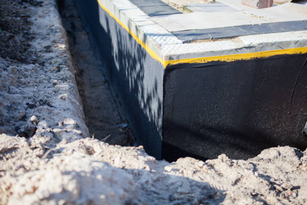 Professional Basement Waterproofing technician working in Avilla, IN